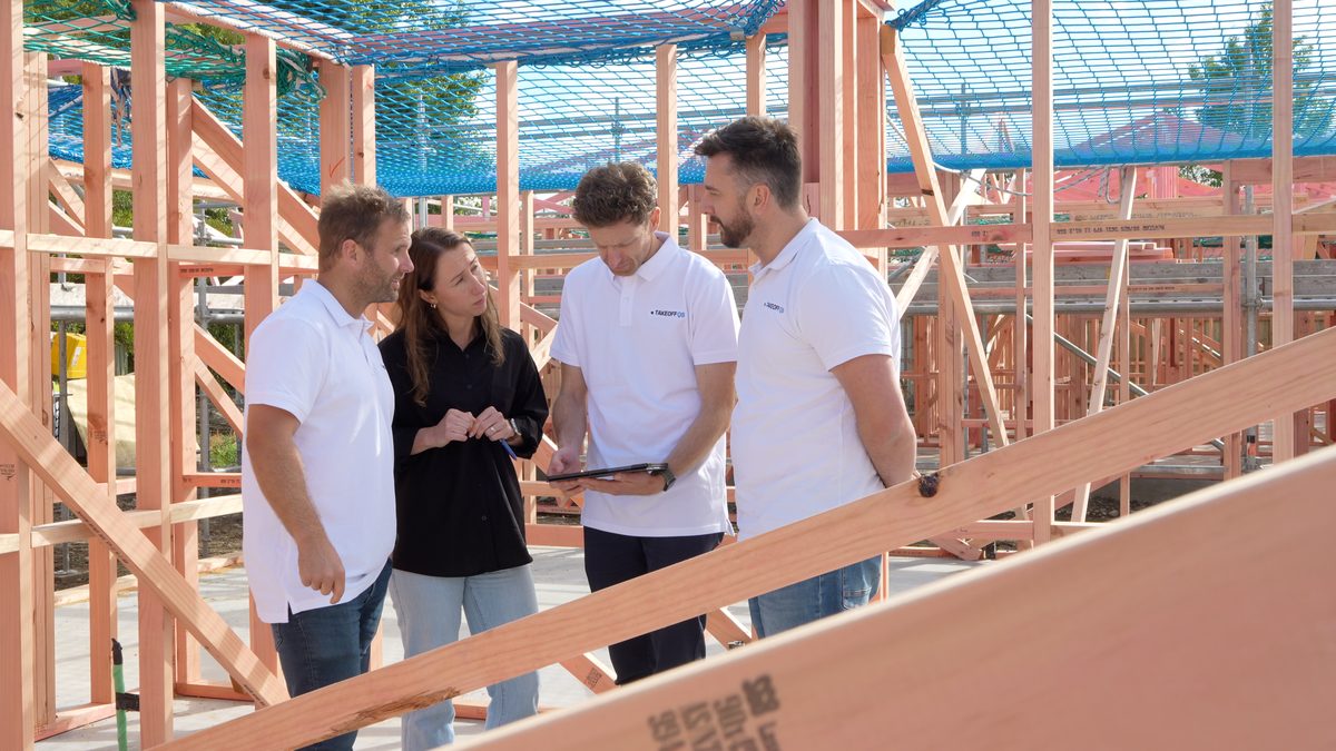 TakeoffQS team reviewing a build on site